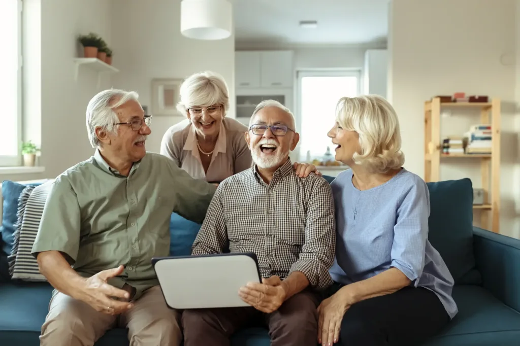 People standing around computer at a senior living community in Phoenix, Arizona